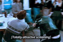 a man in a leather jacket is screaming in front of a crowd of people