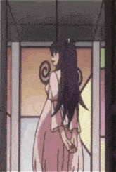 a girl with long purple hair is standing in front of a stained glass window .