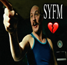 a man in a blue tank top pointing with syfm written in white