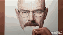 a drawing of a man with glasses and a mustache is being made in animatica