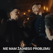 a group of men standing next to each other with the words nie mam zadnego problemu below them