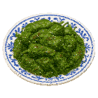 a blue and white plate of green peppers with brown spots