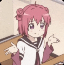 a girl with pink hair is sitting at a table with her arms outstretched and shrugging her shoulders .