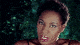 a close up of a woman with red lips