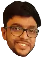 a man with glasses and a beard is smiling for the camera