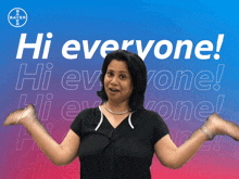 a woman is standing in front of a poster that says hi everyone