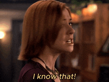 a woman says " i know that " in a purple shirt