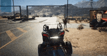 a video game screen shows a man driving a buggy in the desert