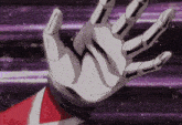 a hand in a skeleton glove is reaching out in a purple background
