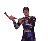 a man in a yamaha racing suit holds a red horn