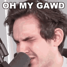 a close up of a man 's face with the words oh my gawd written above him