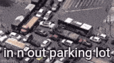 an aerial view of a busy city street with a lot of cars .