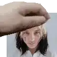 a hand is touching a woman 's forehead in a pixel art .
