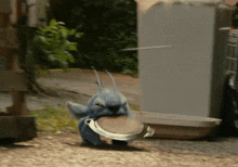 a stuffed animal with a bucket in its mouth is running
