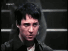 a close up of a person 's face with a shocked look on their face