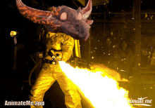 a man in a gold suit is holding a flamethrower with animateme.app written on the bottom right