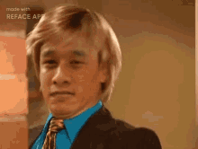 a man in a suit and tie with his mouth open .