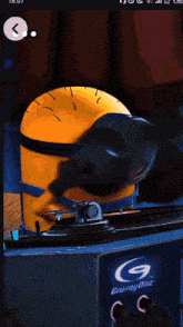 a picture of a minion wearing headphones and a record player that says gruray disc on it