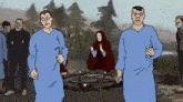 a group of people are standing around a circle with candles in it .