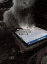 a cat is looking at a cell phone with the words me waiting for a message from you