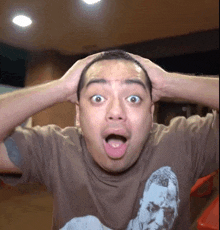 a man wearing a t-shirt with a picture of a man with his mouth open