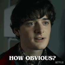 a close up of a man 's face with the words how obvious written below him