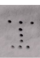 a heart made out of snow with a few holes in it