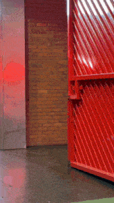 a man walking through a red gate with the words " good morning " on the bottom
