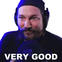 a man with a beard wearing headphones says " very good "