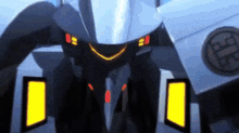 a close up of a robot 's face with a yellow light on the front