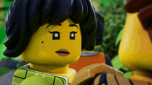 a close up of a lego girl with a black spot on her face