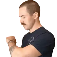 a man with a mustache is wearing a watch on his left wrist