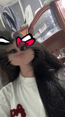 a girl with a cat sticker on her face