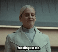 a woman in a white coat is saying you disgust me .