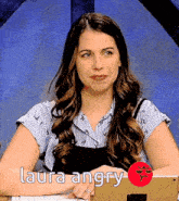 a woman is sitting in front of a laptop with the words laura angry on the bottom