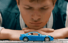 Looking At A Toy Car GIF - Ansel Elgort Look Up Baby Driver GIFs