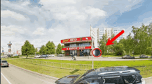 a red arrow points to a burger king building