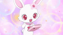 a white rabbit with a cherry on its head is holding a pink phone .