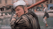 a movie clip from back to the future shows a man with a helmet on his head