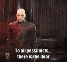 a bald man in a red suit is pointing at the door