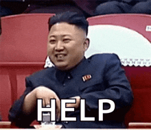 kim jong un is sitting in a stadium with his hands in his pockets and says `` help '' .