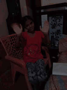 a woman in a red shirt that says strong brand