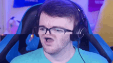 a man wearing glasses and headphones makes a funny face