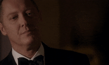 a man in a tuxedo with the words " that was a mistake " behind him