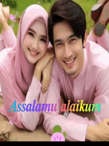 a man and a woman are posing for a picture with the words assalamu alaikum on the bottom right