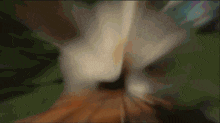 a blurry image of a person 's face with a green background