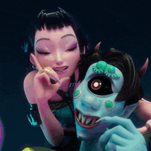 a woman with a ring on her finger is standing next to a monster