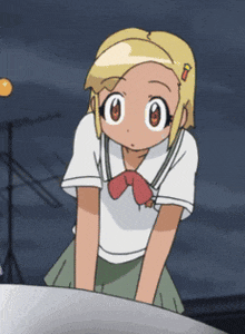 a girl with blonde hair and a red bow tie