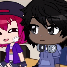 a boy with headphones around his neck and a girl with pink hair