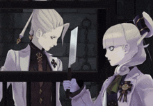 a man and a woman are standing next to each other holding a knife